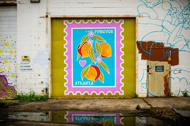 Colorful mural of Atlanta-themed forever postage stamp with peach fruit and flowers